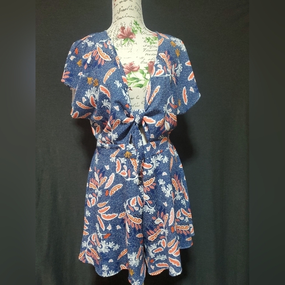 Navy Blue Floral Romper with V-Neck and Flutter Sleeves